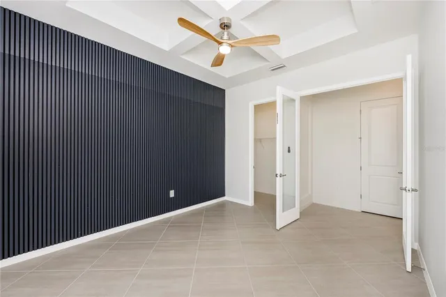 a swimming pool view with a seating space and a garden view