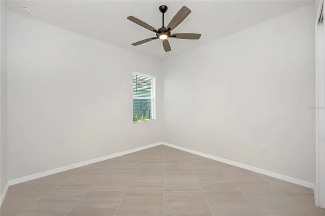 a front view of a house with glass windows and furniture