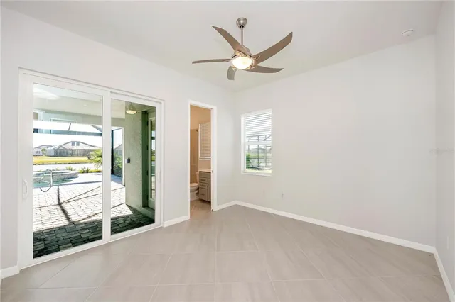 a view of a room with gym equipment and a large window