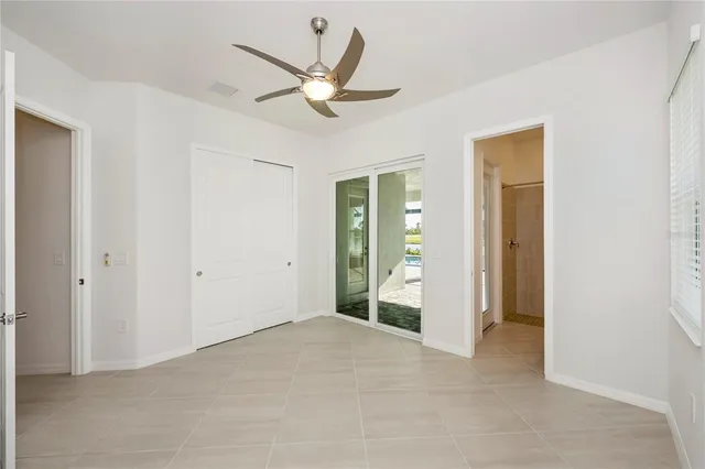 a living room with lots of furniture and a chandelier