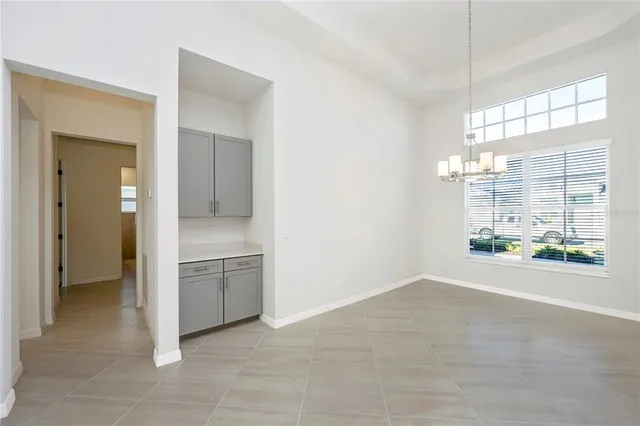 a kitchen with stainless steel appliances a refrigerator sink and stove