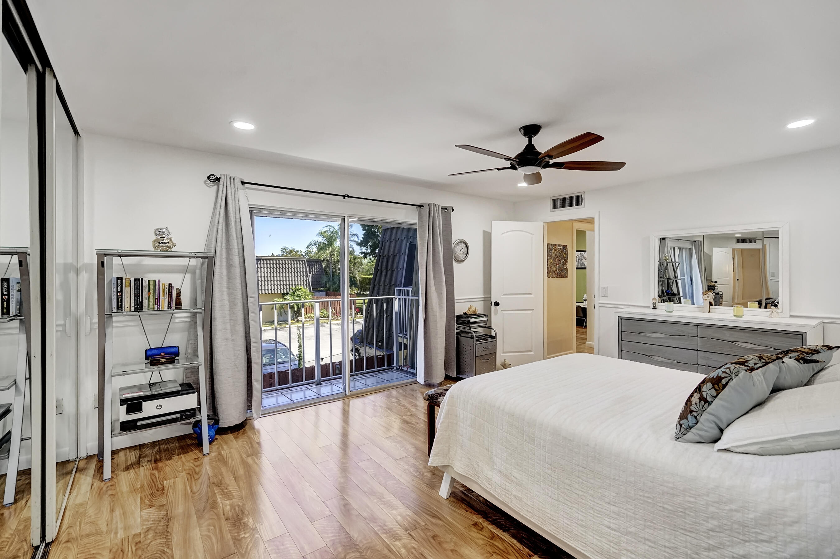 22176 Boca Rancho Drive, Unit C Boca Raton, FL 33428 - Photo 16 of 34 a bedroom with a bed and a large window with outer view