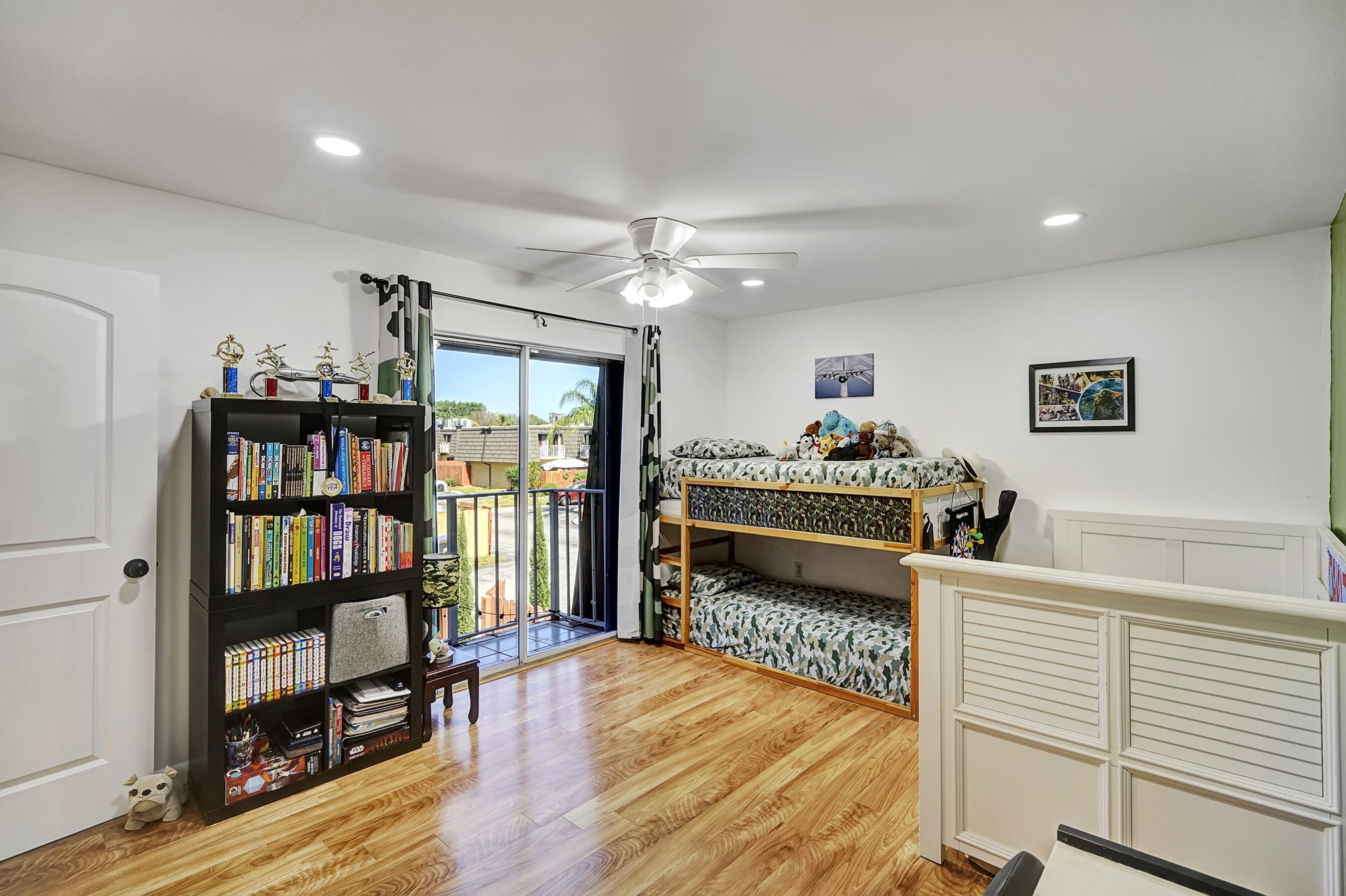 22176 Boca Rancho Drive, Unit C Boca Raton, FL 33428 - Photo 21 of 34 a bedroom with furniture and a book shelf