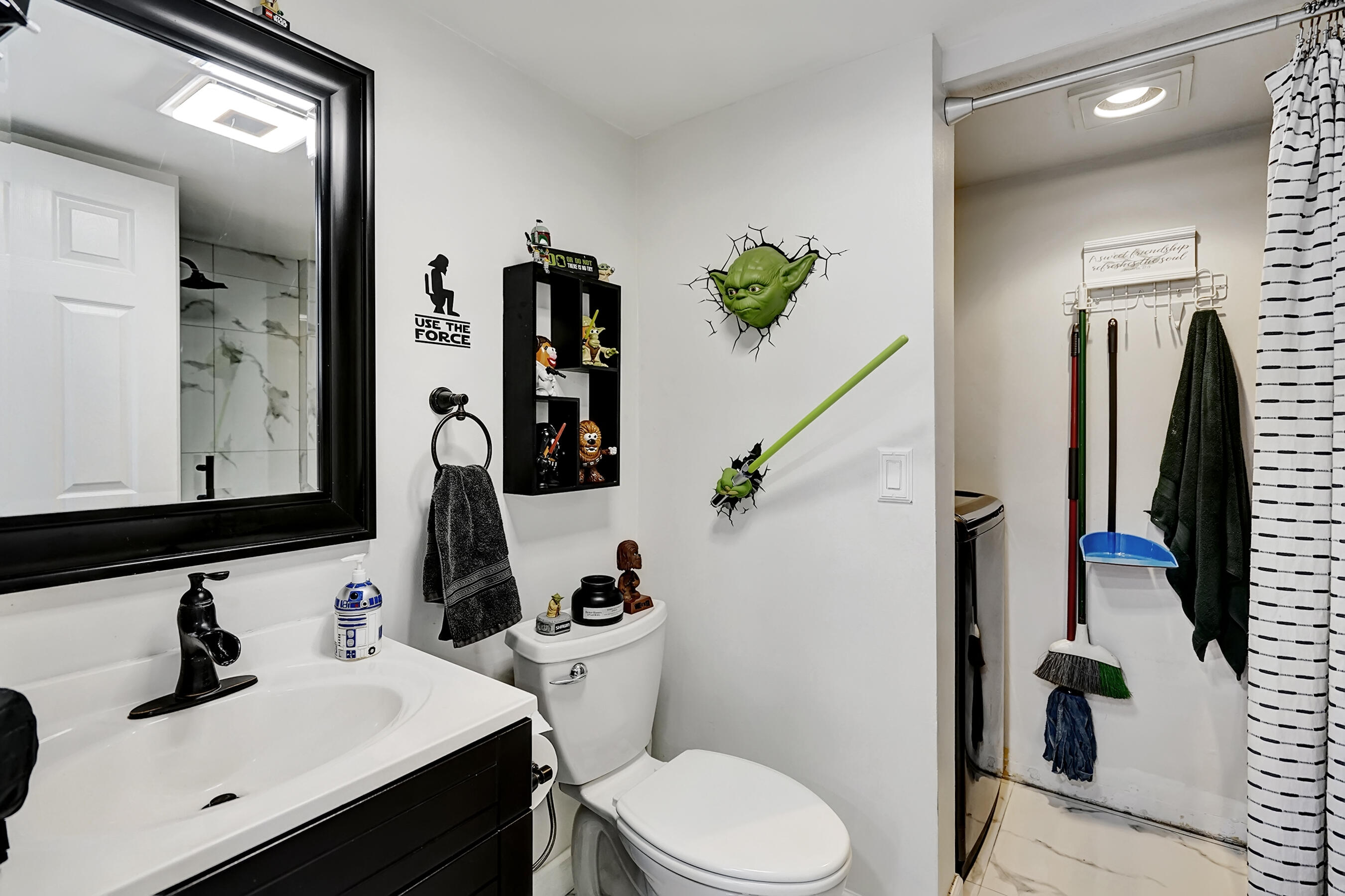 22176 Boca Rancho Drive, Unit C Boca Raton, FL 33428 - Photo 23 of 34 a bathroom with a toilet sink and mirror