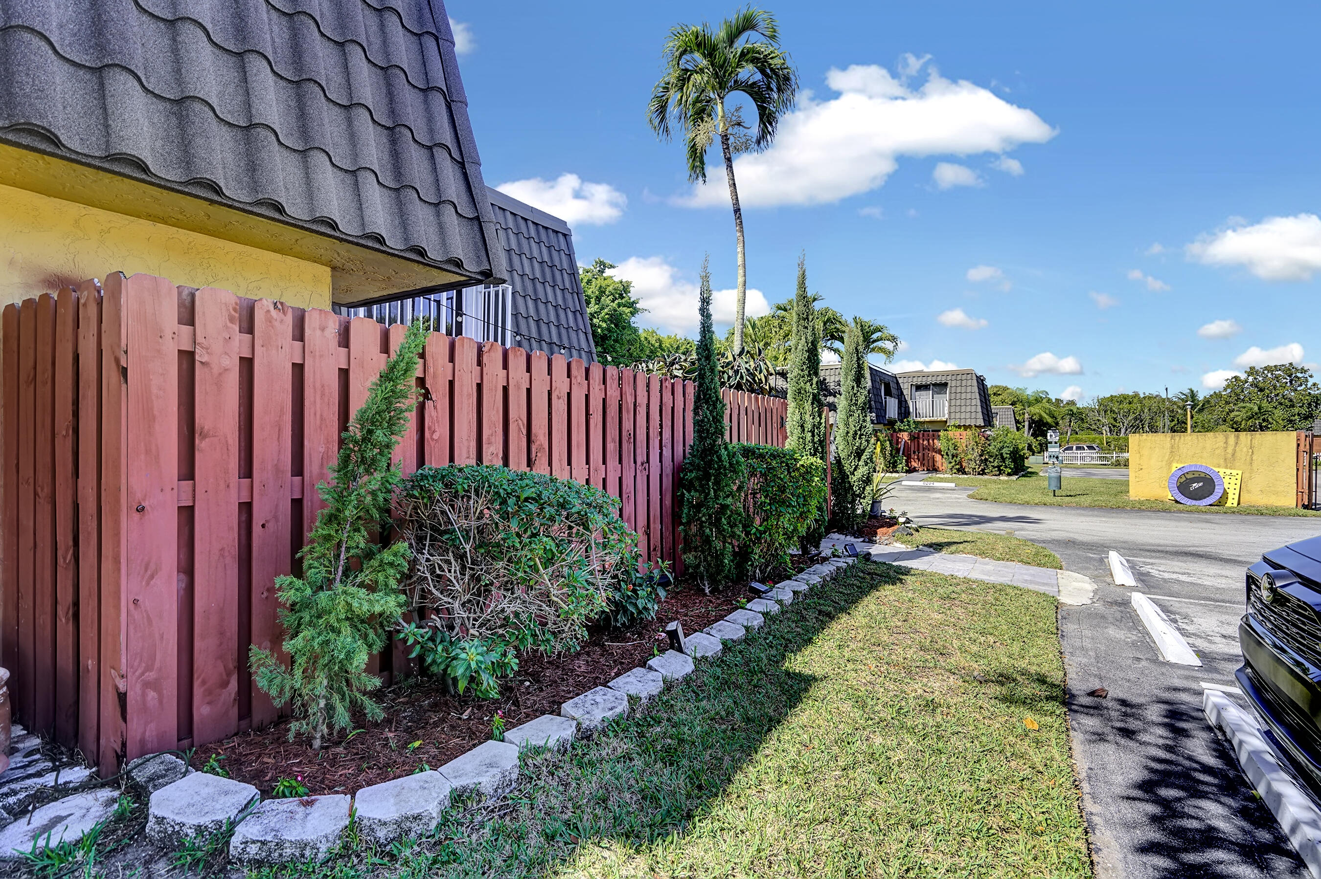 22176 Boca Rancho Drive, Unit C Boca Raton, FL 33428 - Photo 28 of 34 a view of a backyard with plants