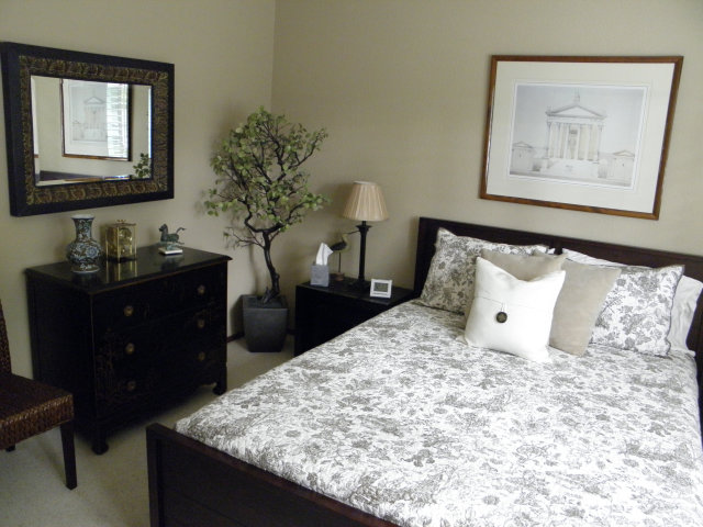 1031 Olympic Lane Seaside, CA 93955 - Photo 11 of 18 a bedroom with a bed and a chandelier
