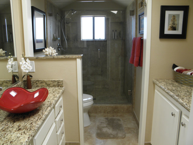 1031 Olympic Lane Seaside, CA 93955 - Photo 13 of 18 a bathroom with a granite countertop sink and a mirror