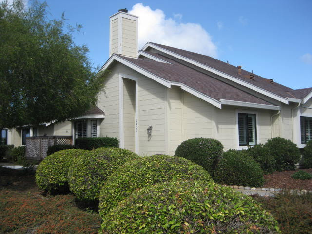 1031 Olympic Lane Seaside, CA 93955 - Photo 2 of 18 a front view of a house with garden