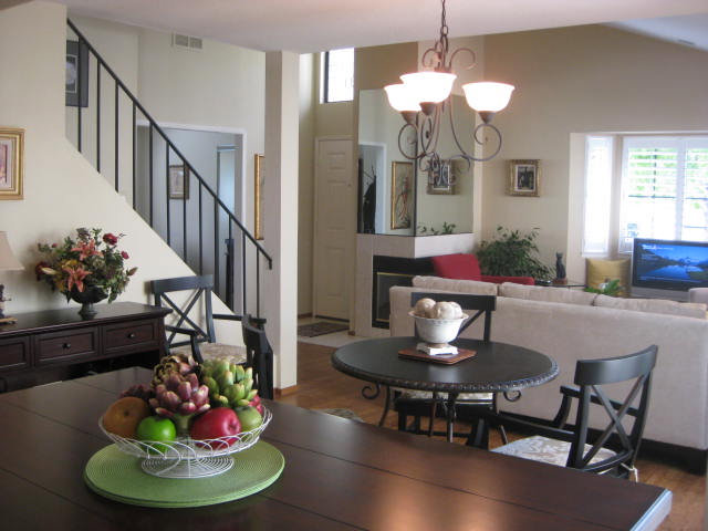 1031 Olympic Lane Seaside, CA 93955 - Photo 3 of 18 a dining room with furniture a chandelier and wooden floor
