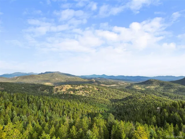 a view of mountain with lake view