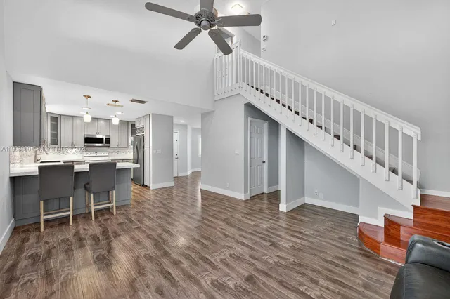 a view of kitchen with cabinets and wooden floor