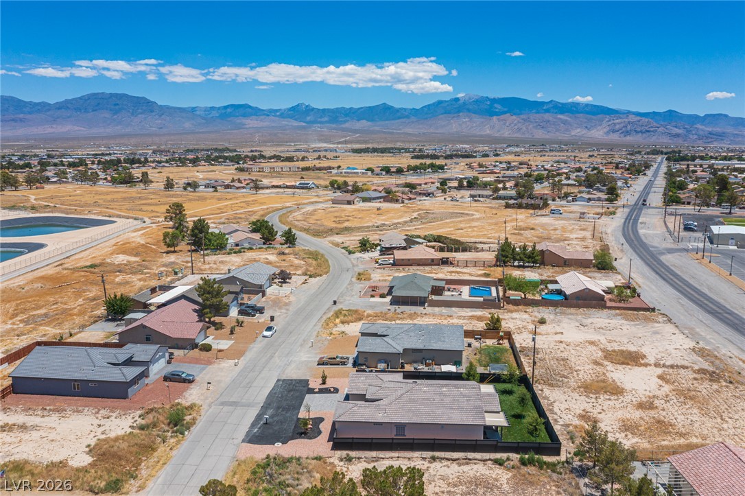 441 Belville Road Pahrump, NV 89048 - Photo 41 of 44 High desert panorama reveals residential pockets and vast open spaces beneath a wide-open sky.
