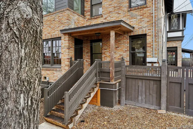 a view of a house with iron stairs