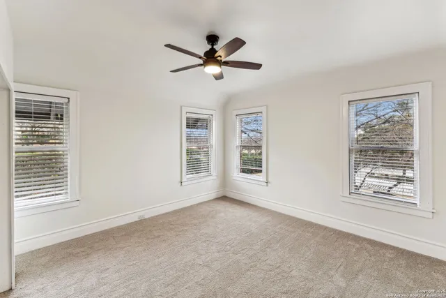 a view of empty room with windows