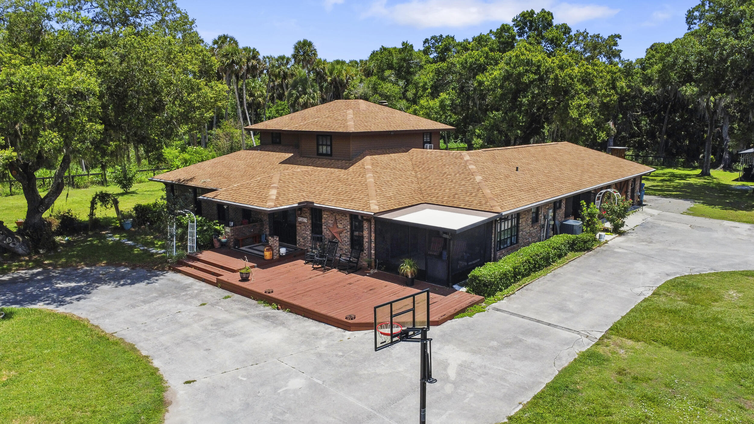 4170 McCarty Road Fort Pierce, FL 34945 - Photo 37 of 57 a view of a patio with a table and chairs under an umbrella
