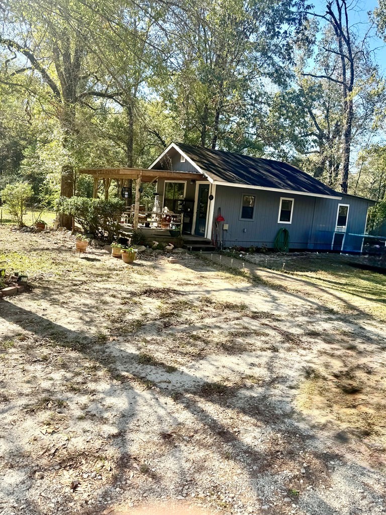 690 Jim Fenley Loop Lufkin, TX 75901 - Photo 2 of 22 a house that has a tree in front of it