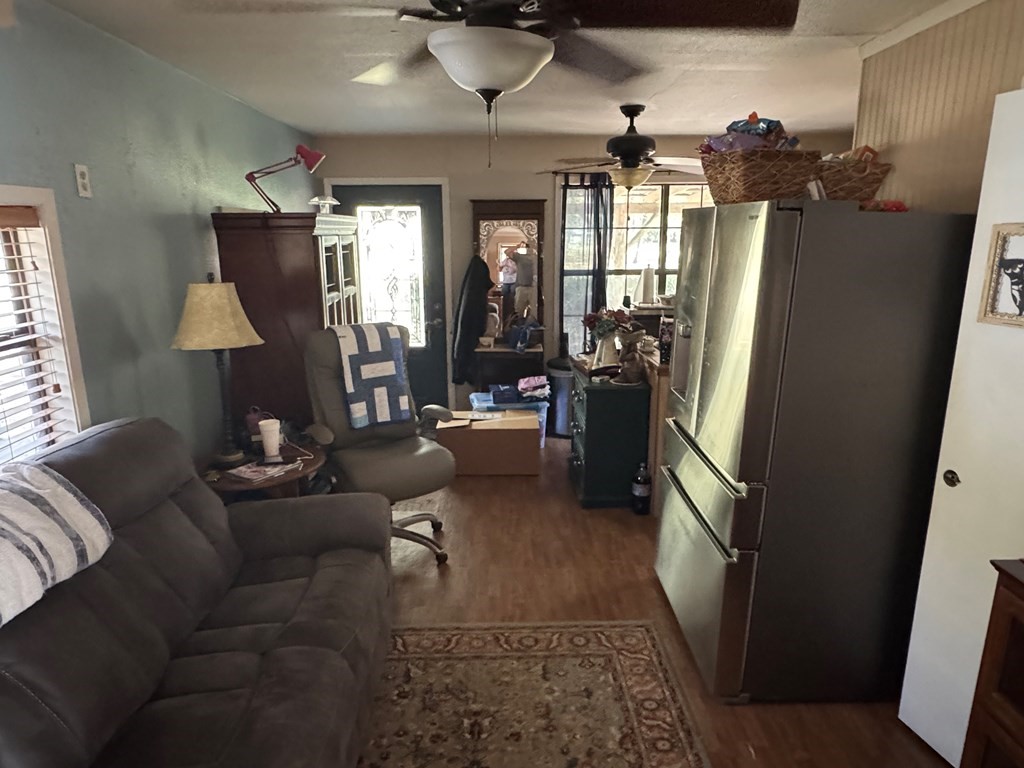 690 Jim Fenley Loop Lufkin, TX 75901 - Photo 22 of 22 a living room with furniture and a chandelier