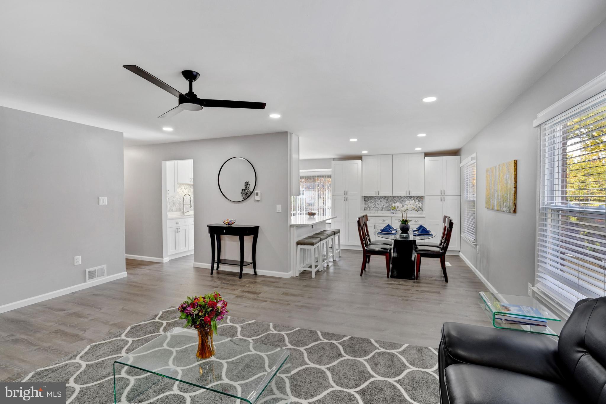 8915 Spur Road Springfield, VA 22153 - Photo 5 of 35 Living Room Flows into Dining and Kitchen