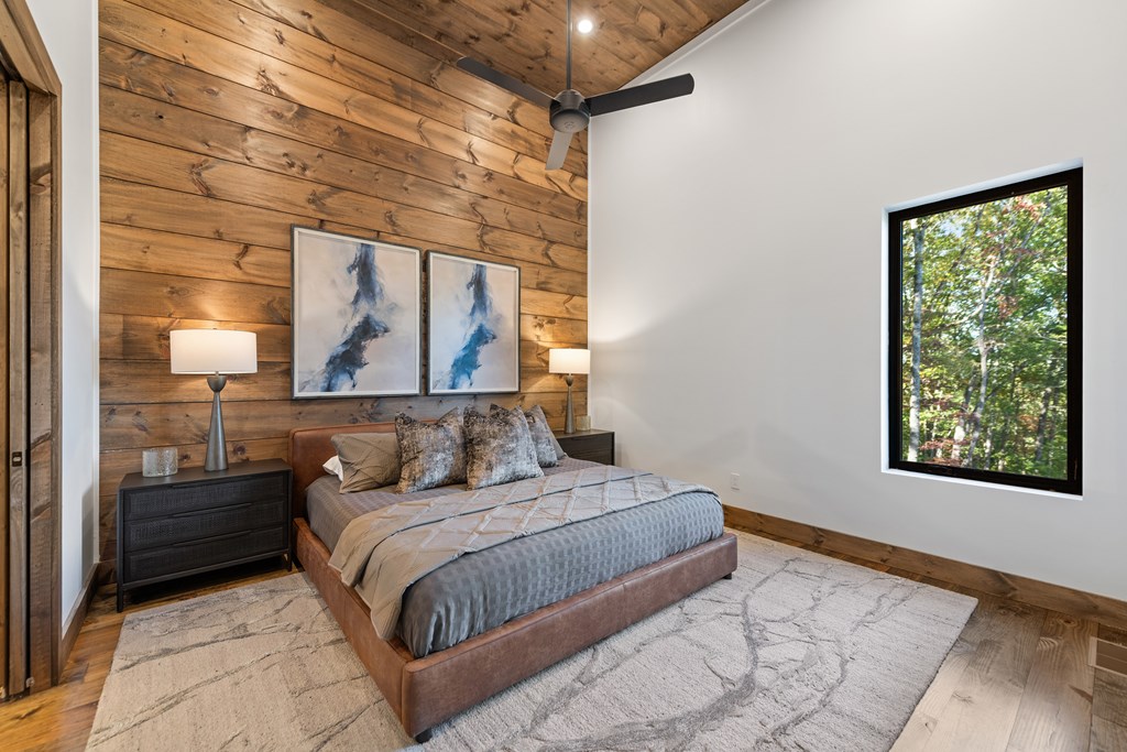 321 Skylight Drive Blue Ridge, GA 30513 - Photo 64 of 89 a bedroom with a large bed and a large window
