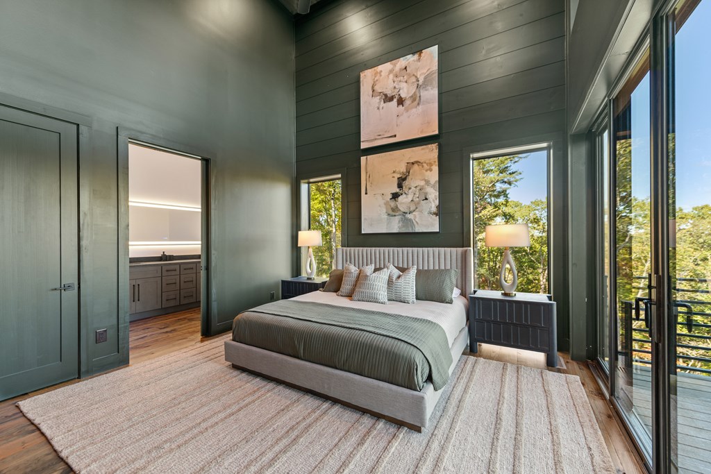 321 Skylight Drive Blue Ridge, GA 30513 - Photo 68 of 89 a bedroom with a bed and a painting on the wall