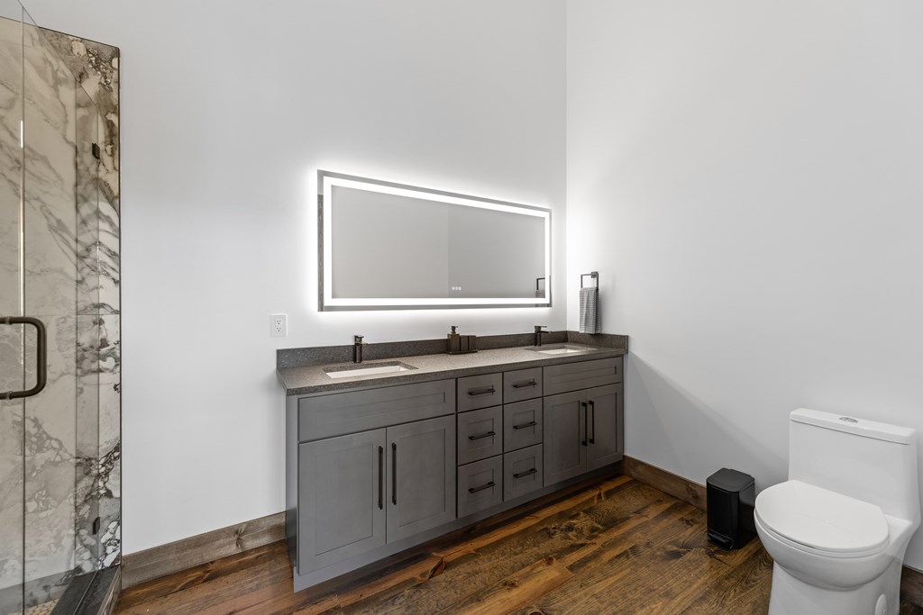 321 Skylight Drive Blue Ridge, GA 30513 - Photo 70 of 89 a bathroom with a granite countertop toilet sink and mirror