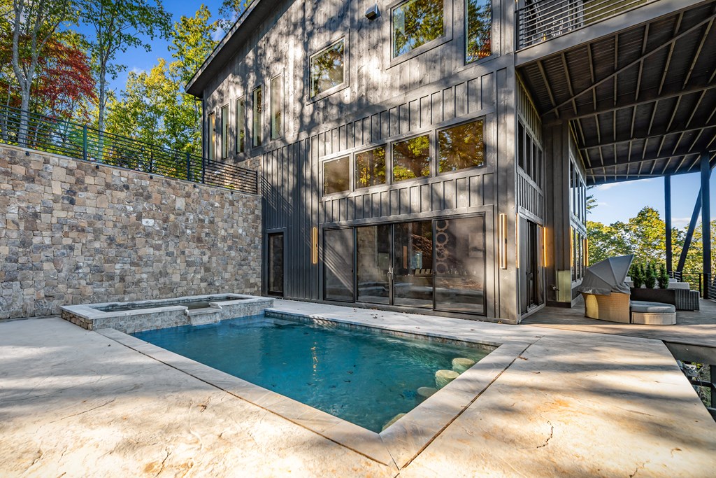 321 Skylight Drive Blue Ridge, GA 30513 - Photo 76 of 89 a view of a patio with a table and chairs and potted plants