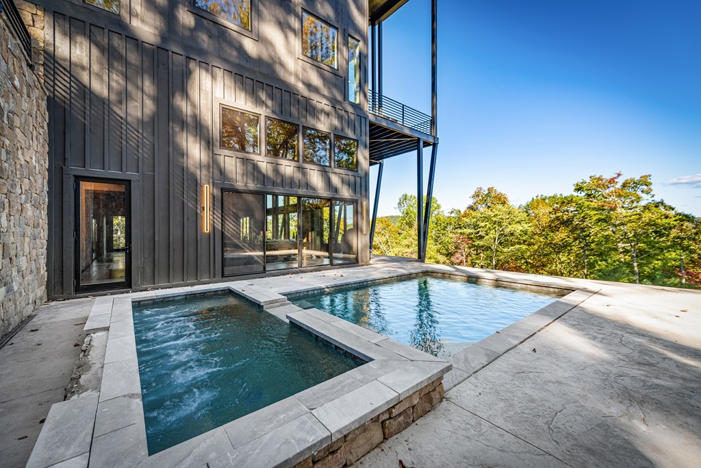 321 Skylight Drive Blue Ridge, GA 30513 - Photo 82 of 89 a view of a swimming pool with a patio