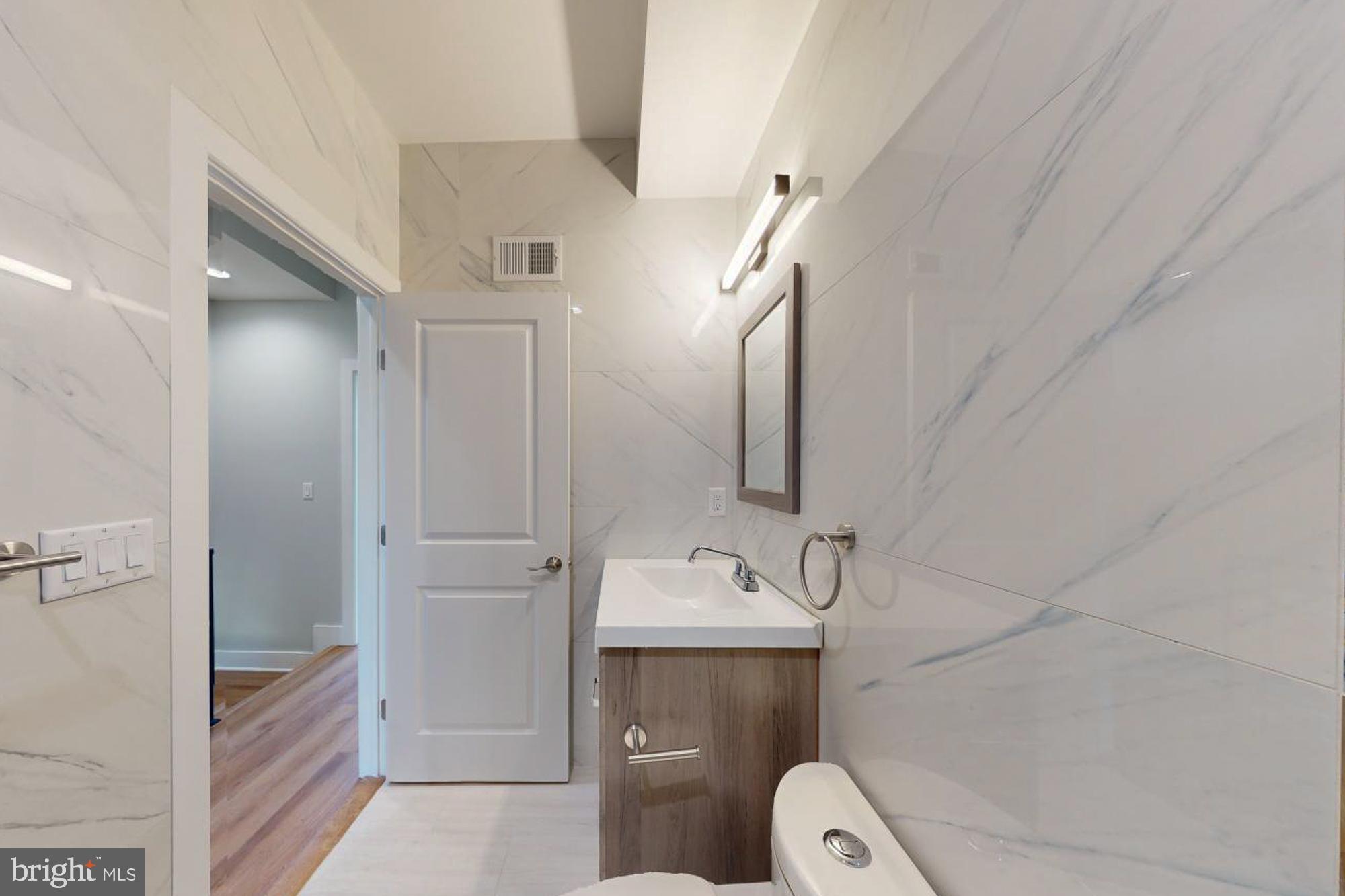 511 North Paxon Street Philadelphia, PA 19131 - Photo 17 of 33 a bathroom with a sink and toilet