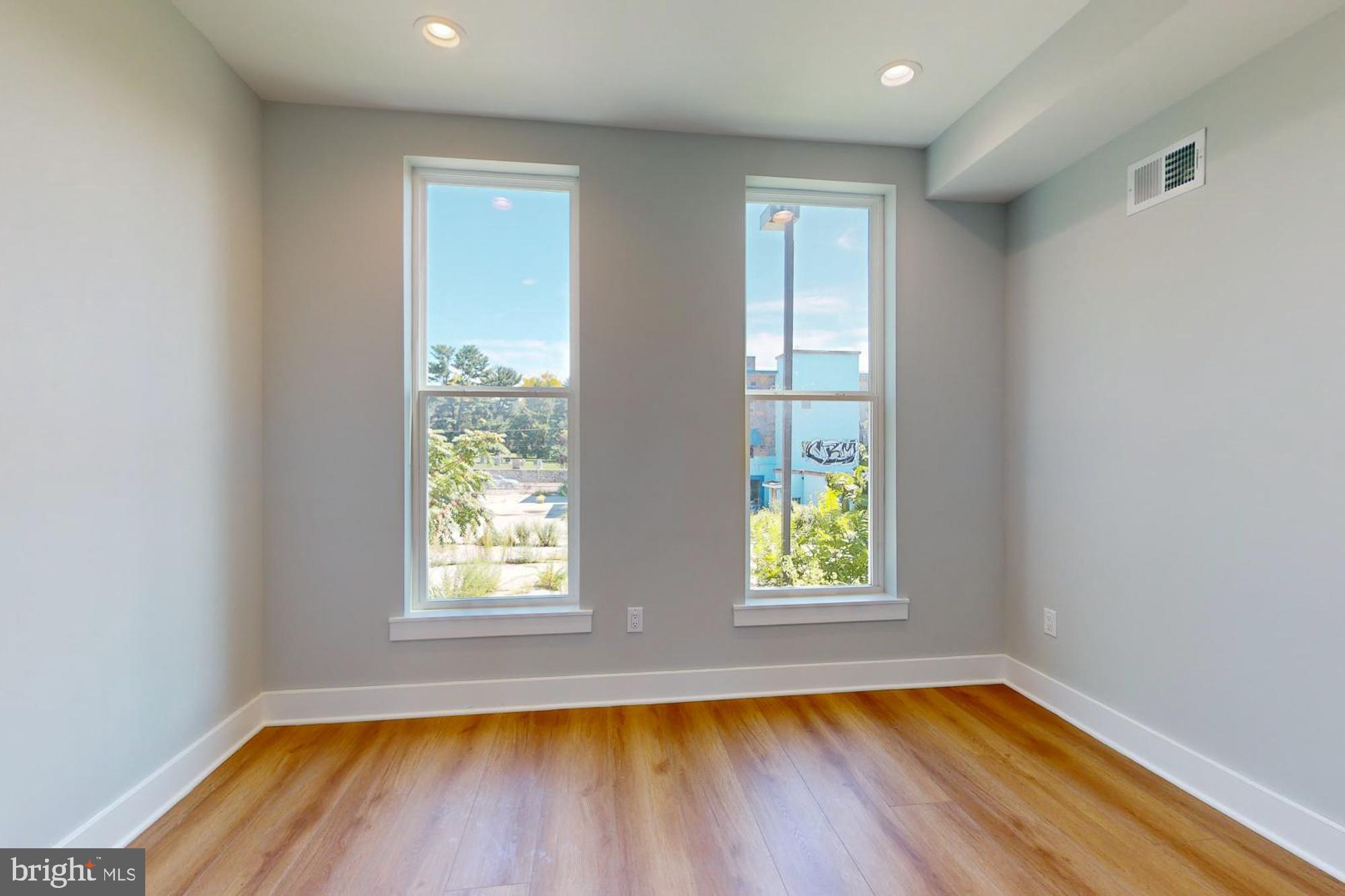 511 North Paxon Street Philadelphia, PA 19131 - Photo 18 of 33 a view of empty room with wooden floor and fan