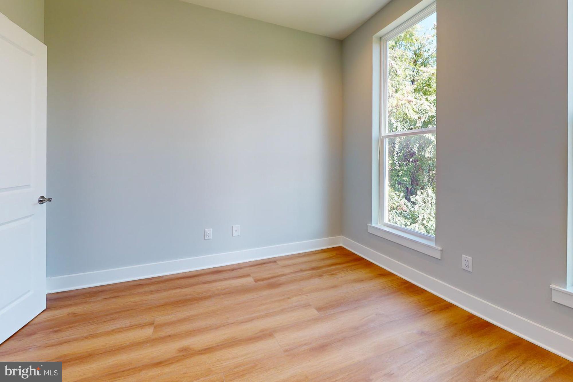 511 North Paxon Street Philadelphia, PA 19131 - Photo 26 of 33 an empty room with wooden floor and windows
