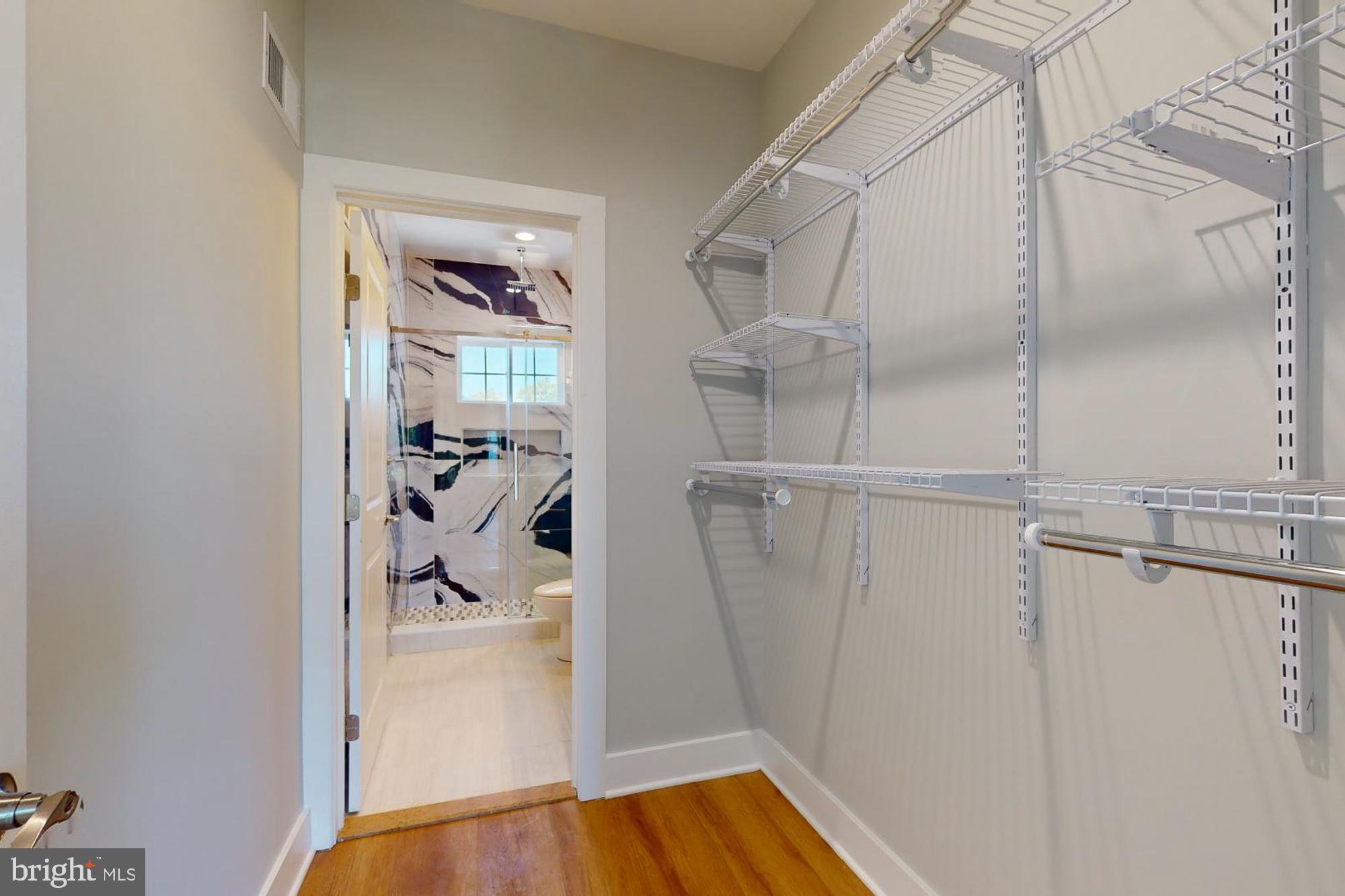 511 North Paxon Street Philadelphia, PA 19131 - Photo 27 of 33 a view of walk in closet with clothes and shoes