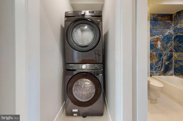 a view of a storage & utility room with washer and dryer
