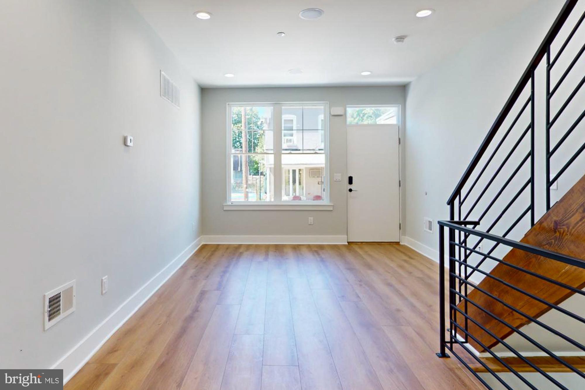 511 North Paxon Street Philadelphia, PA 19131 - Photo 7 of 33 an empty room with wooden floor and windows