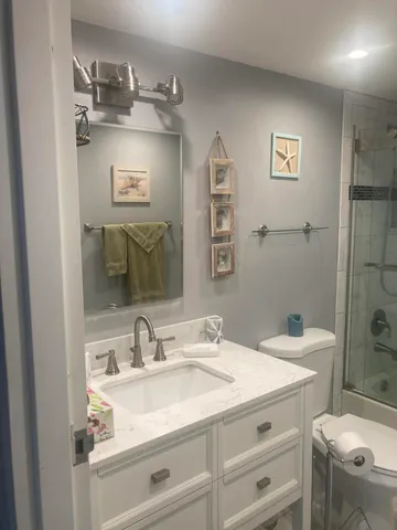 a bathroom with a shower and toilet