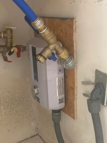 a living room with couches and a floor to ceiling window