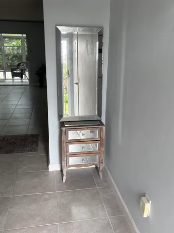 a kitchen with a stove window and cabinets