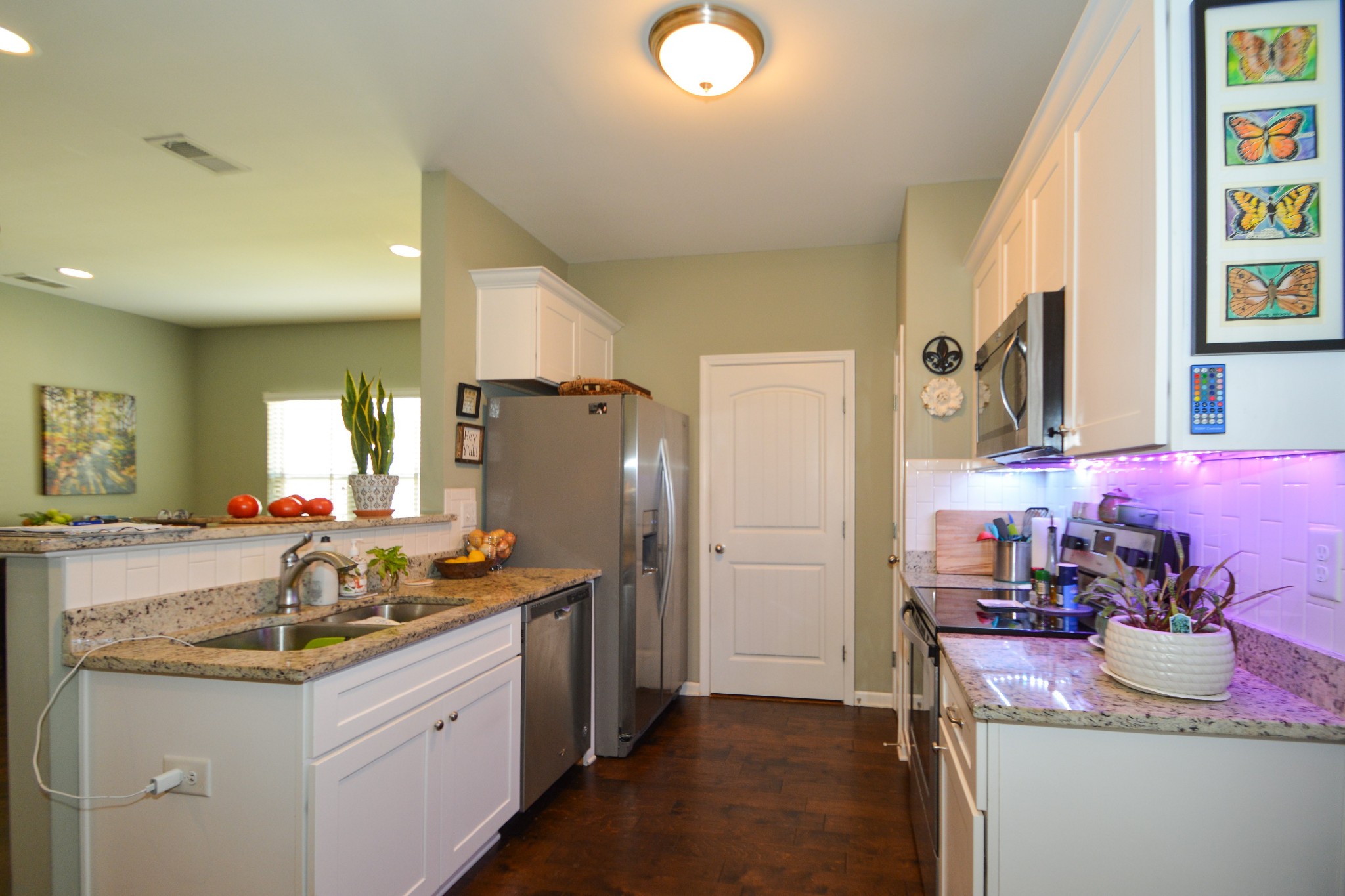 2293 Cason Lane Murfreesboro, TN 37128 - Photo 11 of 32 a kitchen that has a lot of cabinets a sink and a refrigerator