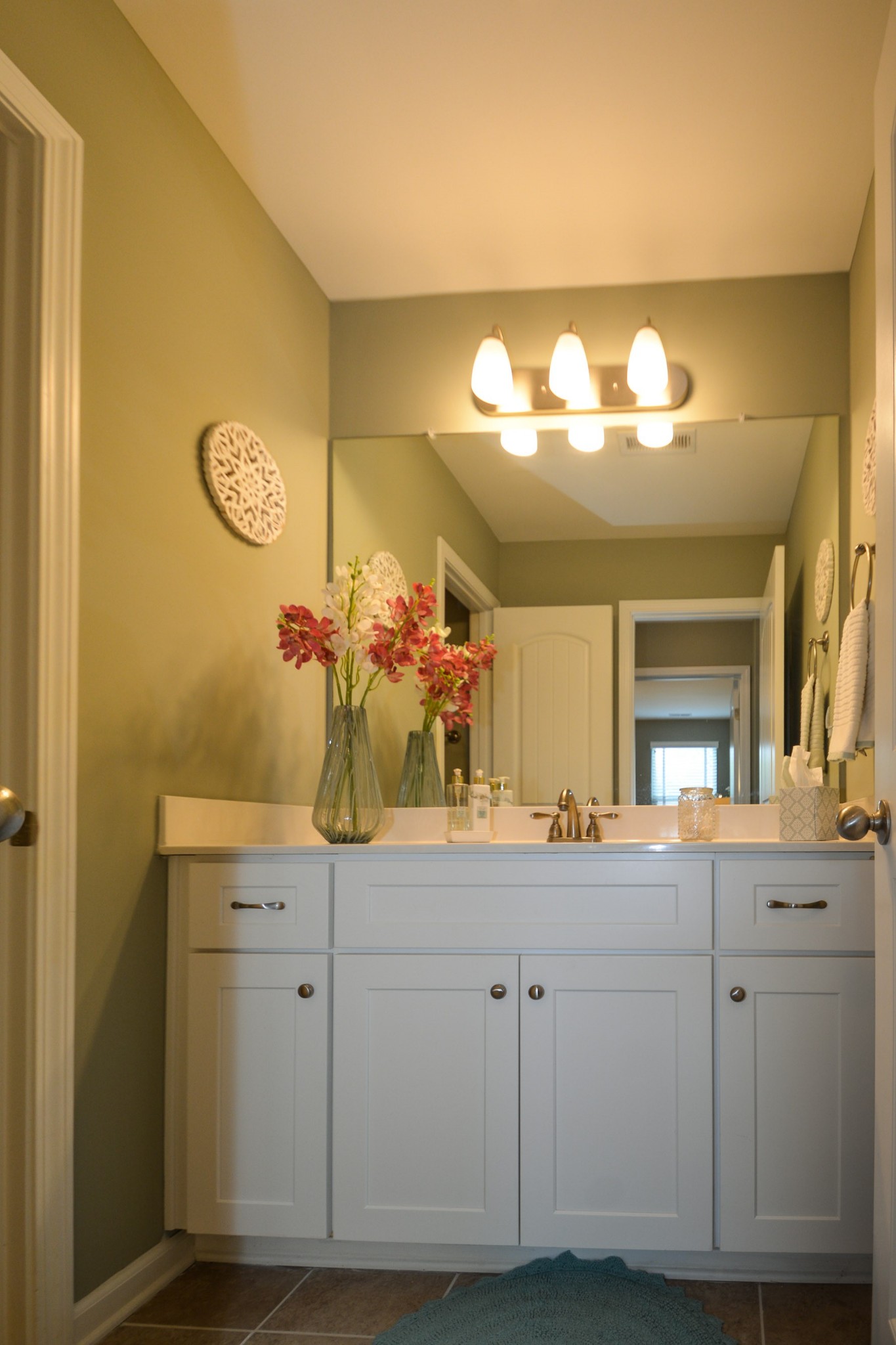 2293 Cason Lane Murfreesboro, TN 37128 - Photo 23 of 32 a bathroom with a sink and a mirror