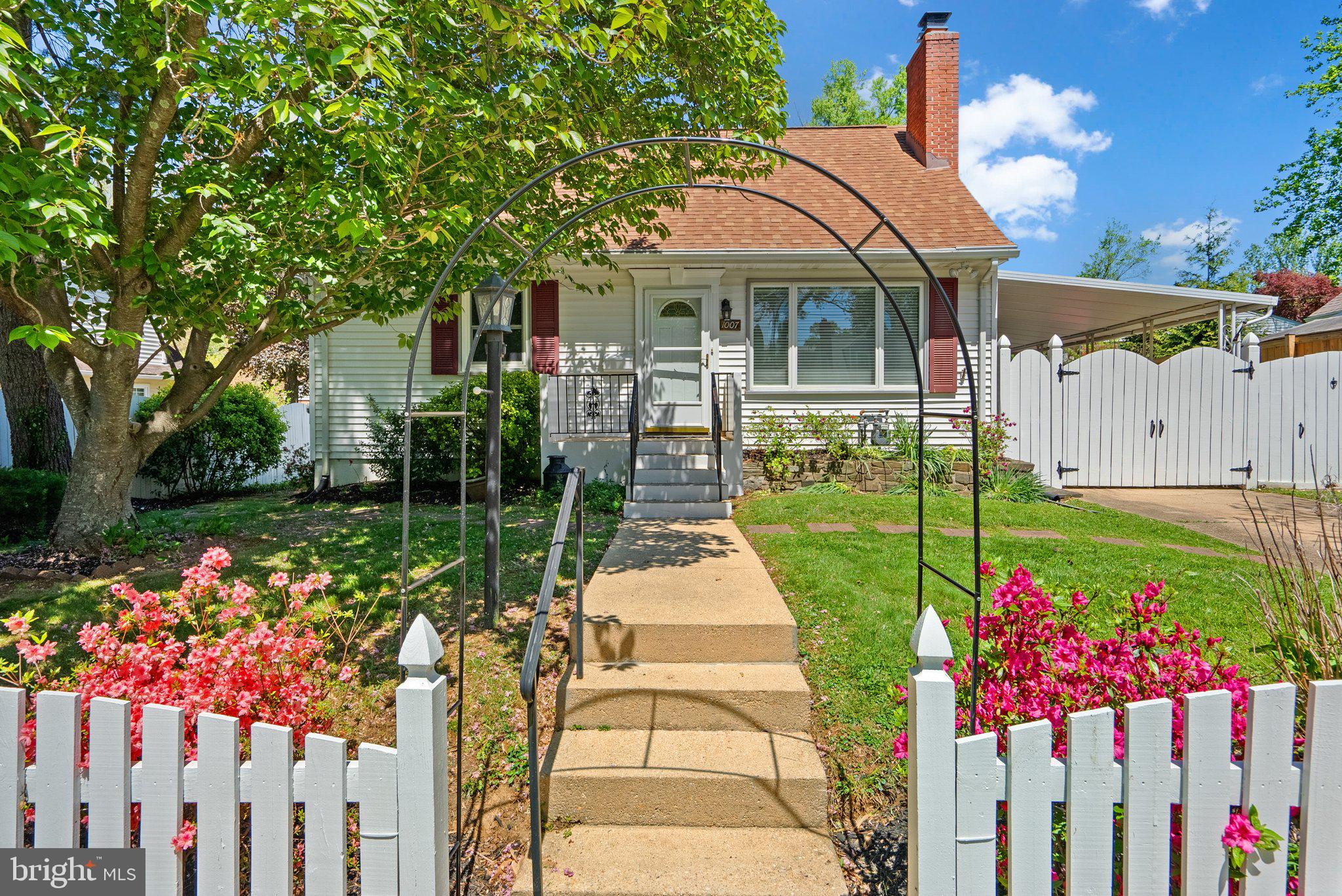 1007 Helena Drive Silver Spring, MD 20901 - Photo 1 of 39 a front view of a house with a yard and fountain