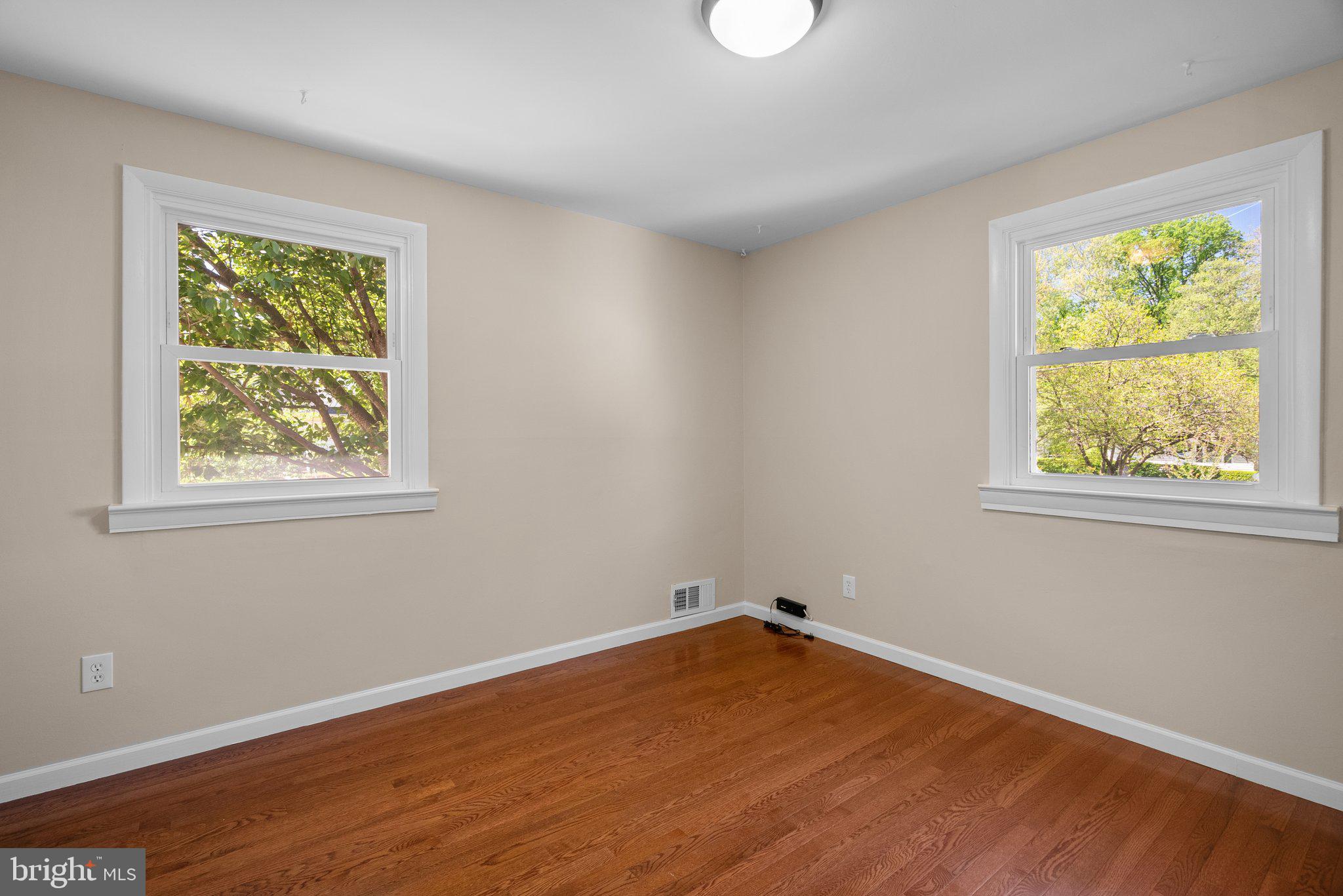 1007 Helena Drive Silver Spring, MD 20901 - Photo 17 of 39 wooden floor in an empty room with a window