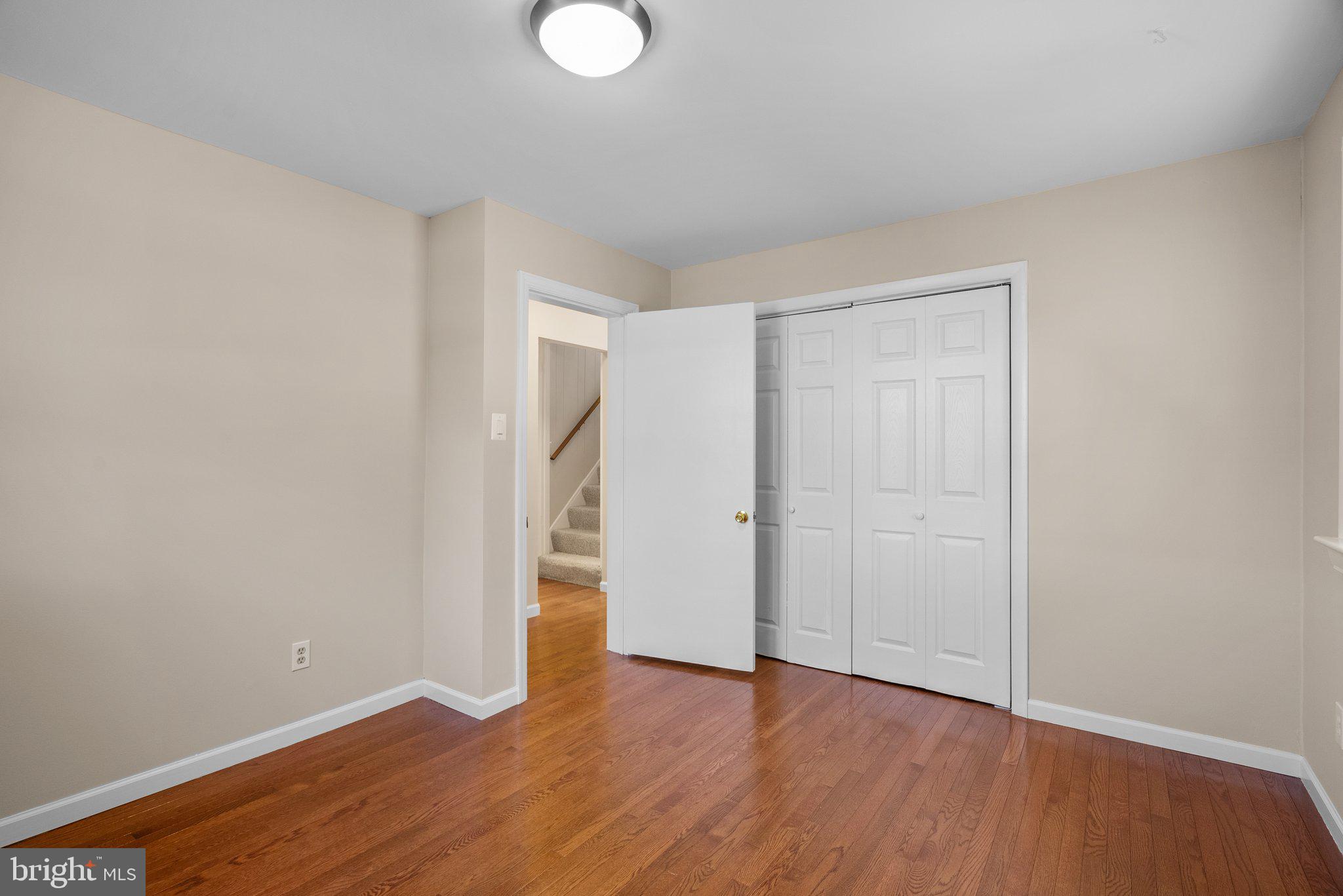 1007 Helena Drive Silver Spring, MD 20901 - Photo 18 of 39 a view of an empty room with wooden floor
