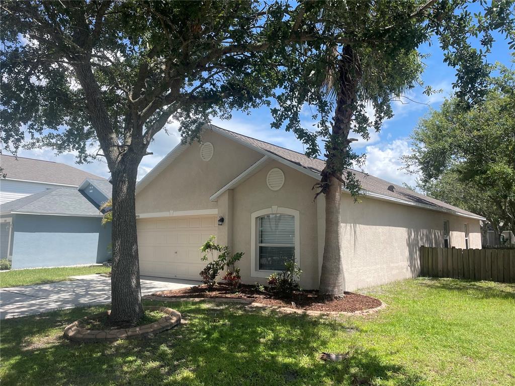 10436 Opus Drive Riverview, FL 33579 - Photo 1 of 1 a front view of house with yard and green space