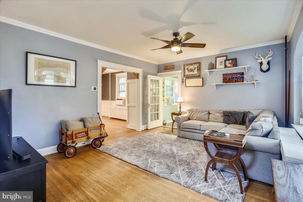5313 Wendley Road Baltimore, MD 21229 - Photo 14 of 37 Living room leads to dining room and cozy sunroom