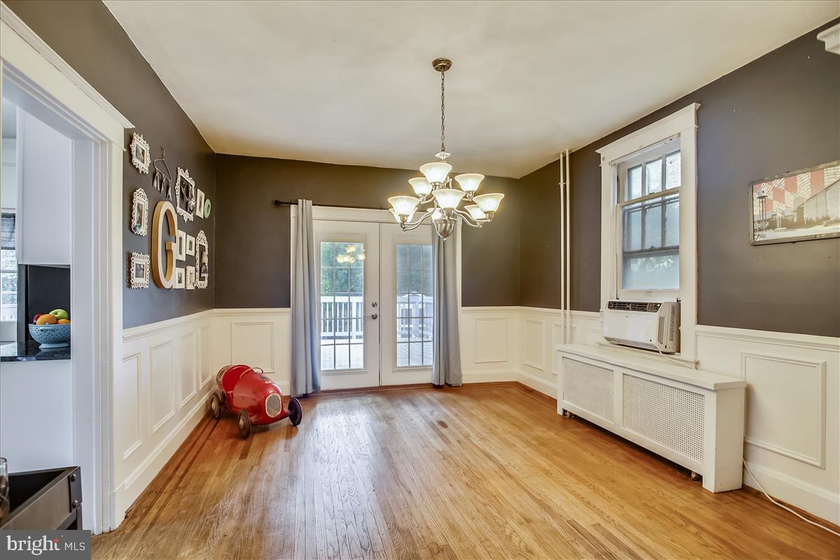 5313 Wendley Road Baltimore, MD 21229 - Photo 15 of 37 Hardwood Dining room with french doors to deck