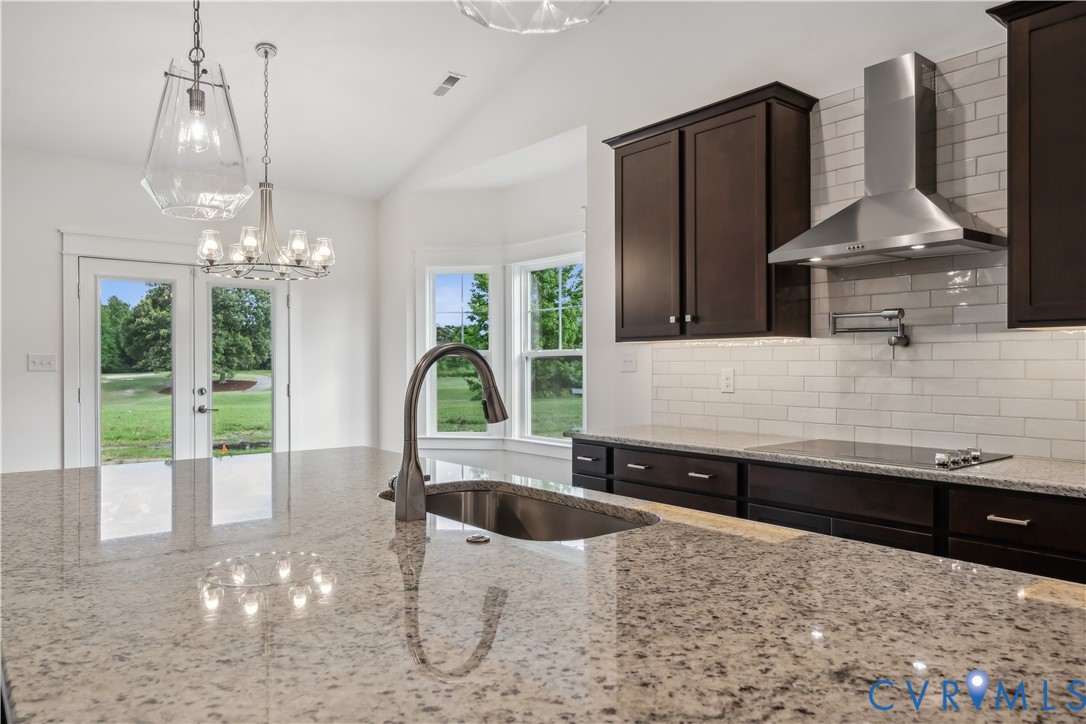 114 Logan Way Tappahannock, VA 22560 - Photo 12 of 28 a view of a kitchen area with furniture and chandelier