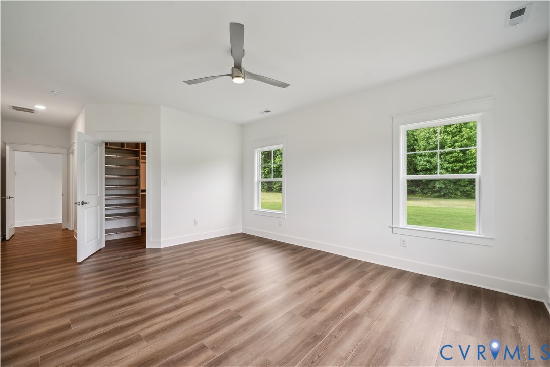 114 Logan Way Tappahannock, VA 22560 - Photo 17 of 28 wooden floor in an empty room with a window
