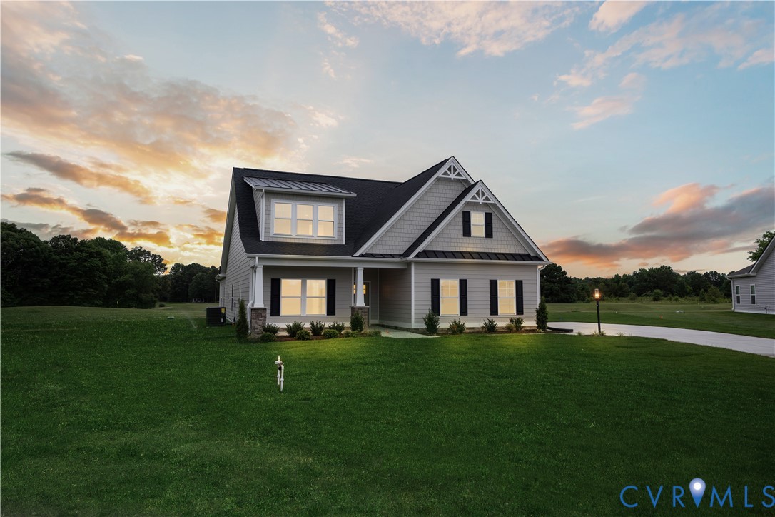 114 Logan Way Tappahannock, VA 22560 - Photo 2 of 28 a house view with a garden space