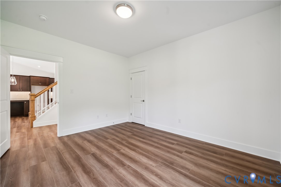 114 Logan Way Tappahannock, VA 22560 - Photo 25 of 28 a view of empty room with wooden floor and fan