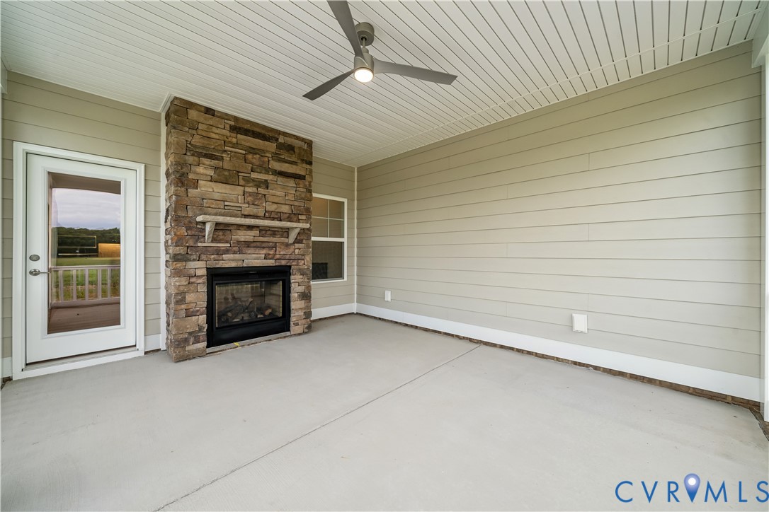 114 Logan Way Tappahannock, VA 22560 - Photo 26 of 28 an empty room with a fireplace and window