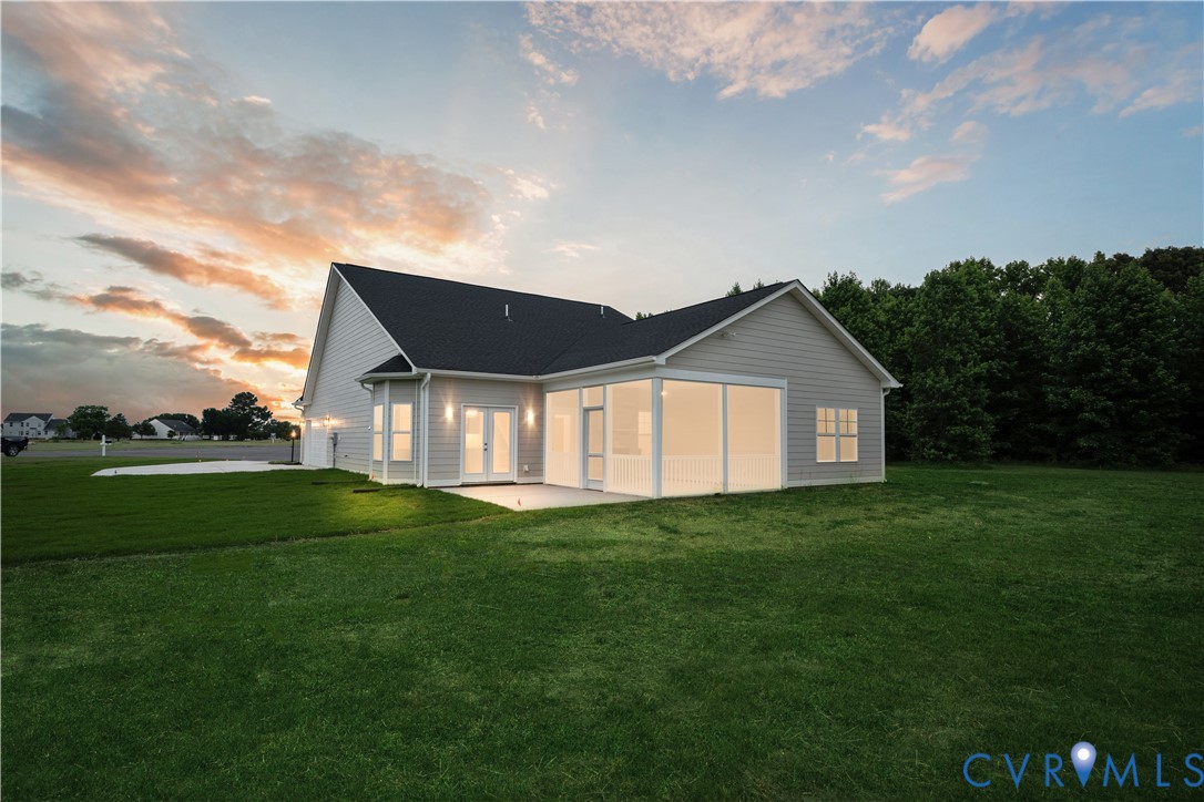 114 Logan Way Tappahannock, VA 22560 - Photo 28 of 28 a front view of a house with a yard and garage
